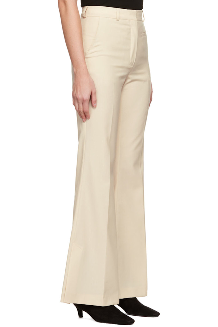 Plain-woven polyester and wool-blend trousers.

· Belt loops
· Four-pocket styling
· Zip-fly
· Central creases at front and back
· Vented cuffs

Supplier color: Vanilla white