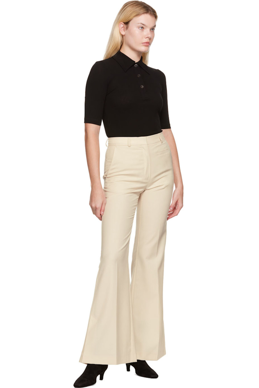 Plain-woven polyester and wool-blend trousers.

· Belt loops
· Four-pocket styling
· Zip-fly
· Central creases at front and back
· Vented cuffs

Supplier color: Vanilla white