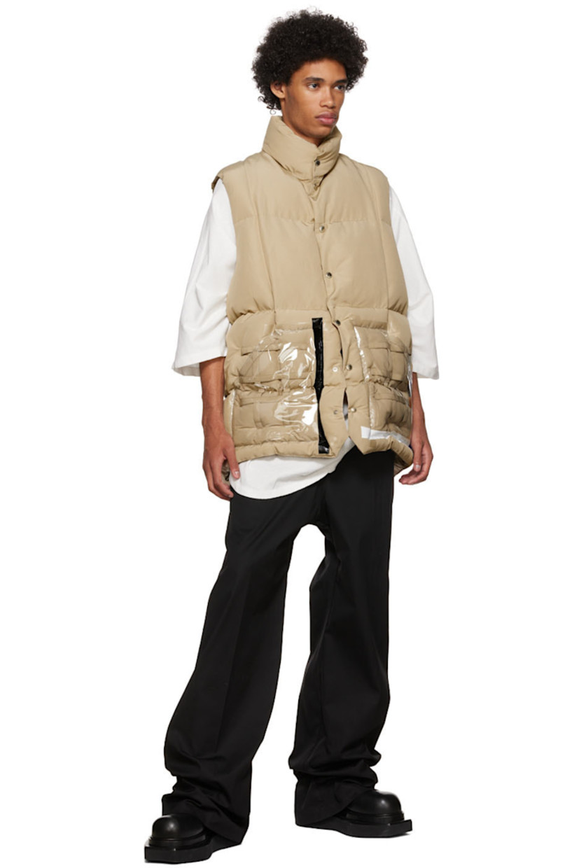 Primaloft® insulated quilted plain woven cotton and nylon-blend vest.

· Stand collar
· Button closure
· Straps and vinyl trim at transparent vinyl patch pockets
· Concealed drawstring at waist
· Nylon ripstop lining
· Logo-engraved silver-tone hardware

Supplier color: Beige