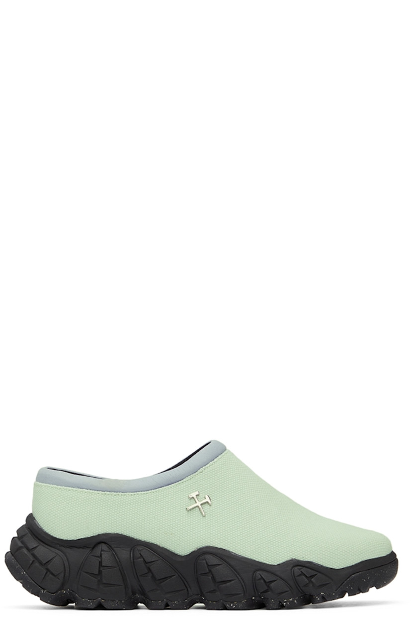 Low-top canvas slip-on sneakers in green.

· Padded faux-leather tongue and collar in purple
· Logo hardware at side 
· Leather lining in black
· Sculptural foam rubber midsole
· Treaded Vibram® rubber outsole 

Supplier color: Green