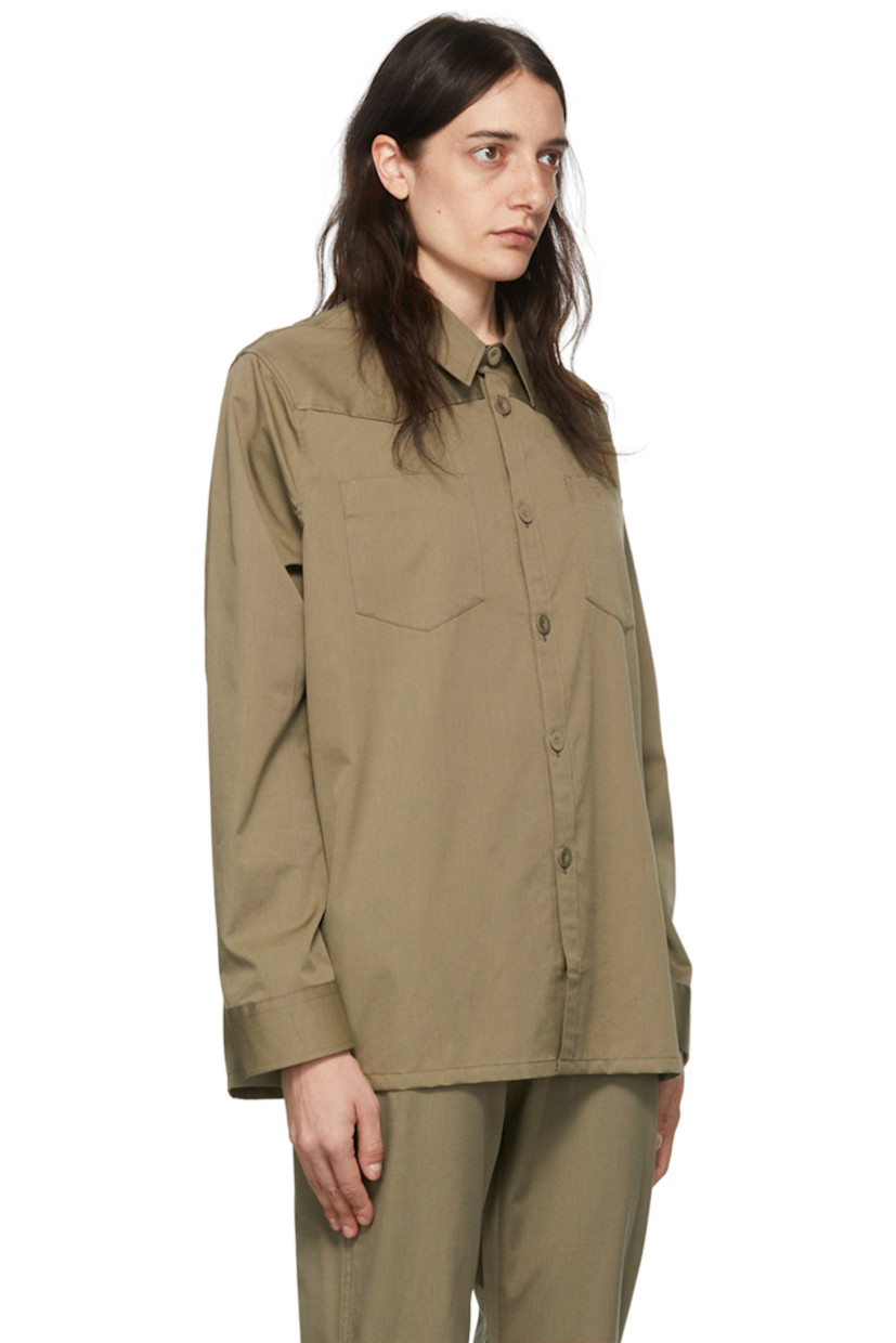Wool-blend poplin shirt.

· Spread collar
· Button closure
· Patch pockets
· Single-button barrel cuffs
· Vented side-seams
· Shell hardware

Supplier color: Hazelnut brown