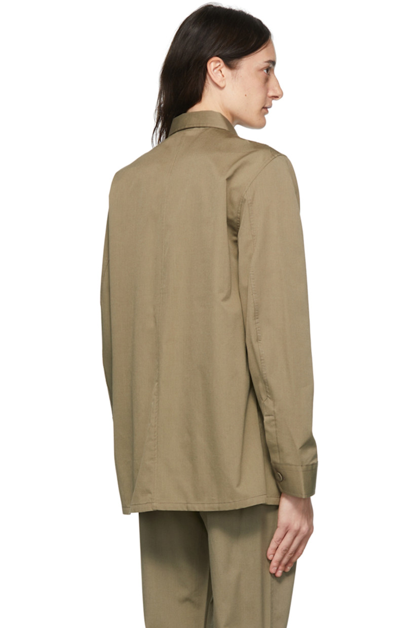 Wool-blend poplin shirt.

· Spread collar
· Button closure
· Patch pockets
· Single-button barrel cuffs
· Vented side-seams
· Shell hardware

Supplier color: Hazelnut brown