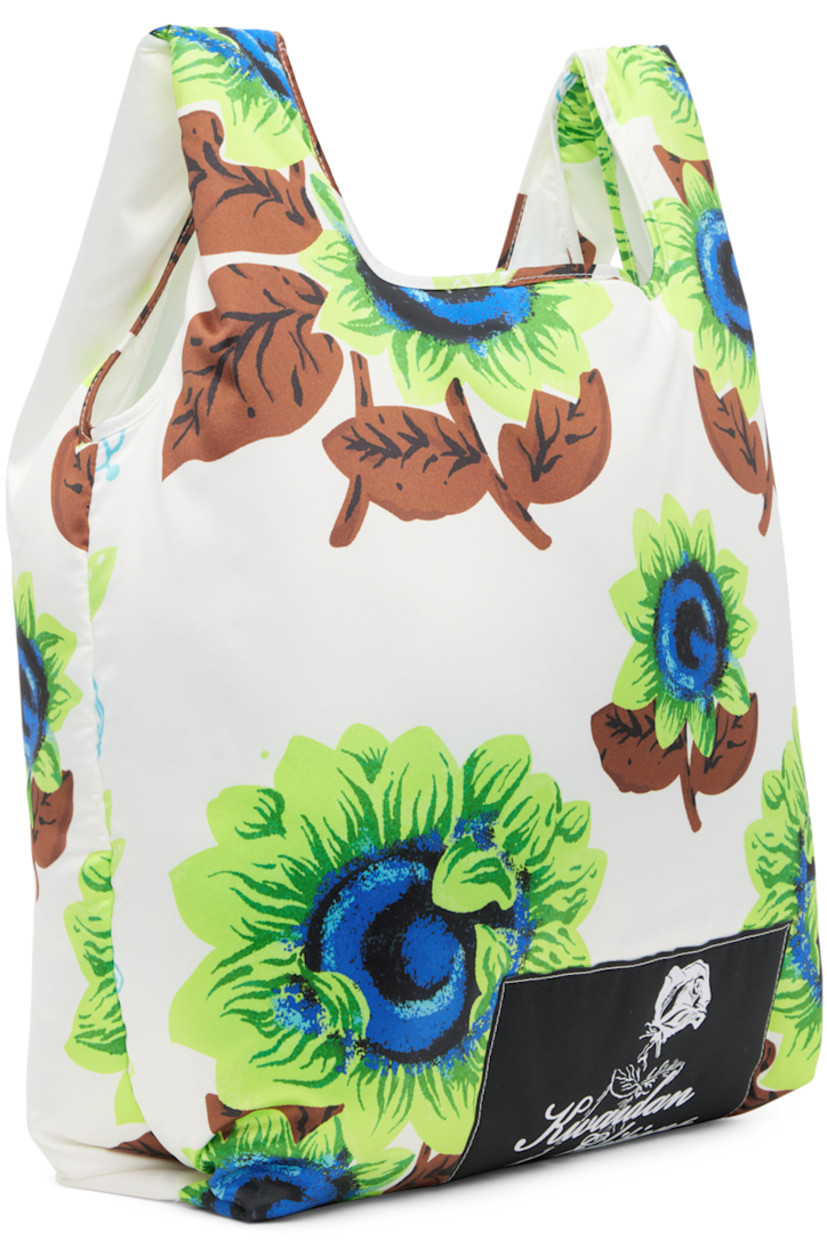 Padded satin tote in white. Graphic pattern printed throughout.

· Fixed carry handles
· Textile logo patch at face
· Satin lining
· H14.5 x W14 x D5.5 in

Supplier color: White