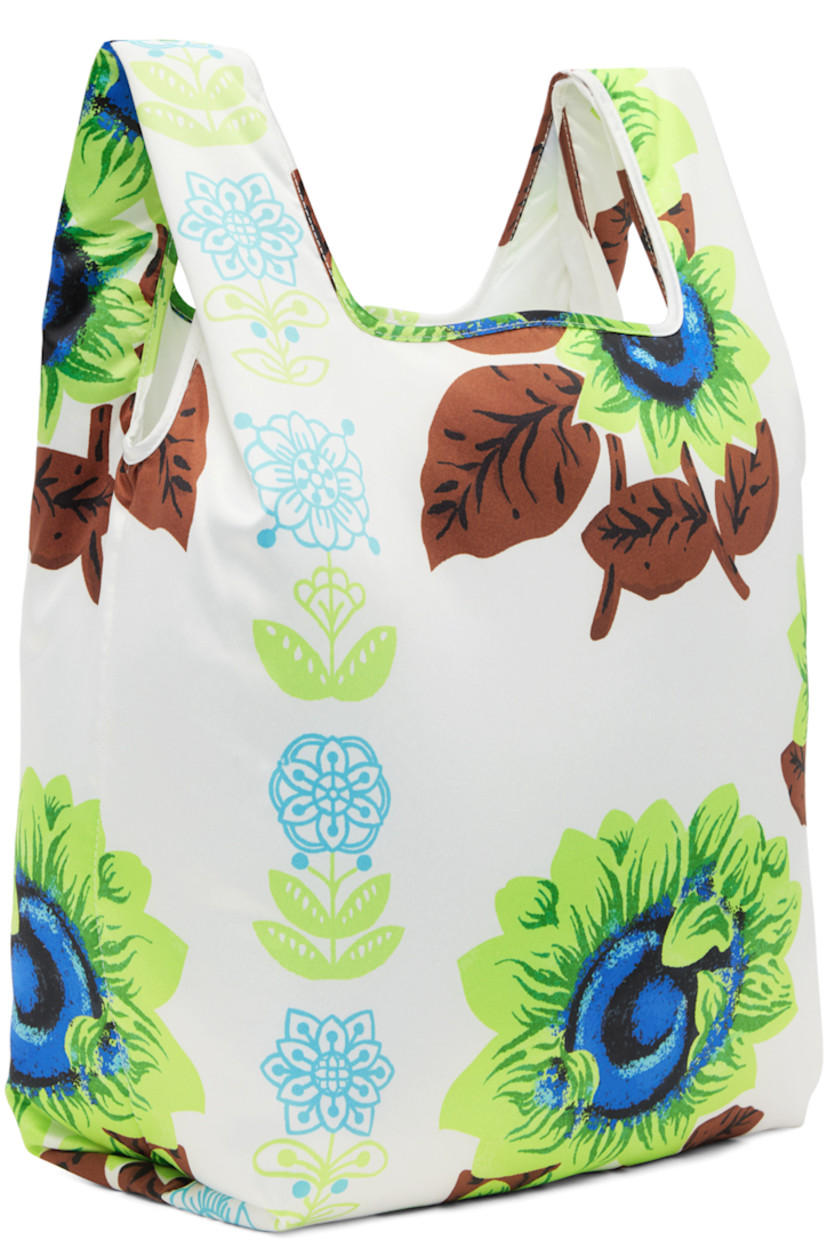 Padded satin tote in white. Graphic pattern printed throughout.

· Fixed carry handles
· Textile logo patch at face
· Satin lining
· H14.5 x W14 x D5.5 in

Supplier color: White