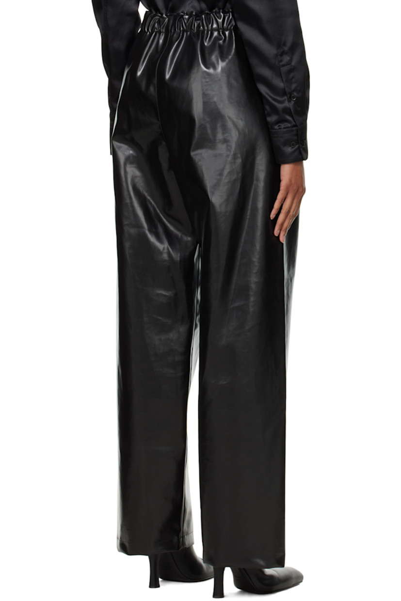 Buffed faux-leather trousers.

· Cinch straps at partially elasticized waistband
· Two-pocket styling
· Zip closure at outseams
· Pleats at front

Supplier color: Black