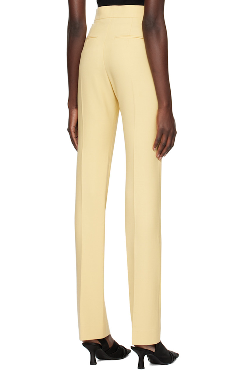 Plain-woven stretch polyester and virgin wool-blend trousers.

· Four-pocket styling
· Zip-fly
· Central creases at front and back

Supplier color: Yellow