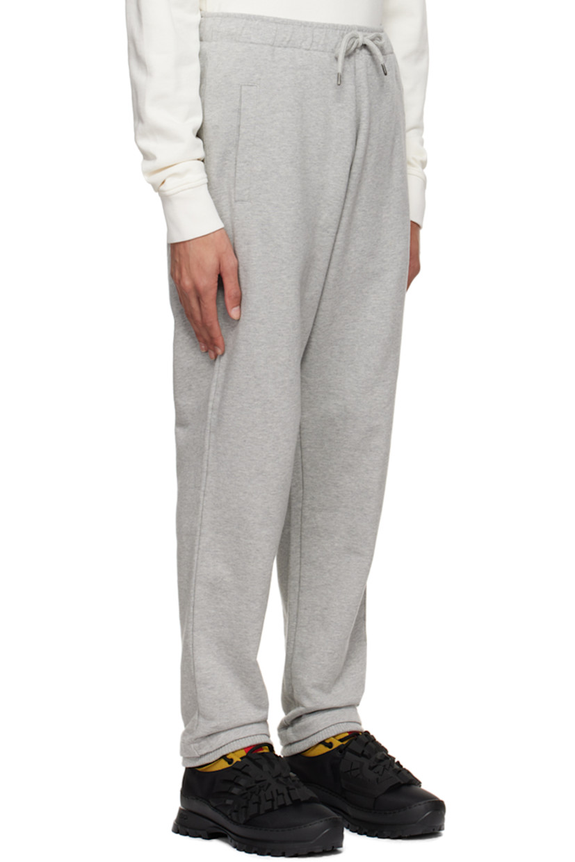 French terry lounge pants.

· Drawstring at elasticized waistband
· Three-pocket styling
· Logo embroidered at front
· Elasticized rib knit cuffs

Supplier color: Heather gray