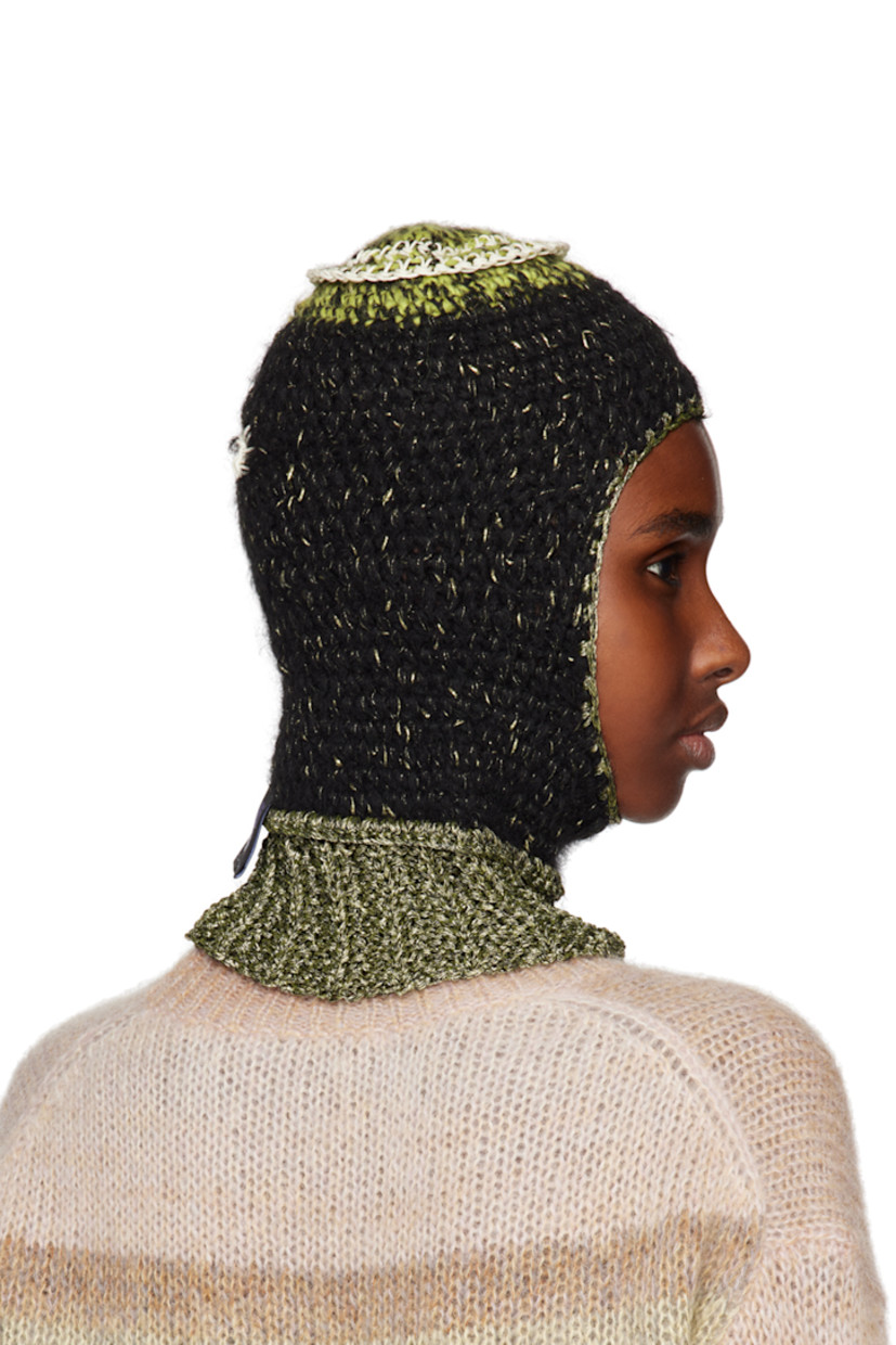 Rib knit upcycled hemp twine, wool, cotton, and polyester balaclava in black. Gold-tone metallic thread detailing throughout.

· Textile logo flag at back face
· Unlined

Face masks and face coverings are final sale and are not eligible for return or exchange.

Supplier color: Black/Gold