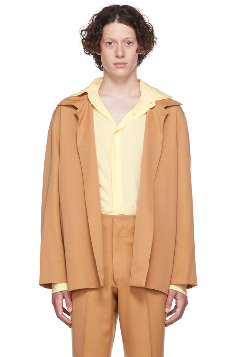 Wool gabardine jacket. 

· Notched lapel
· Open front
· Seam pockets
· Welt pockets at interior
· Partial canvas lining

Supplier color: Camel