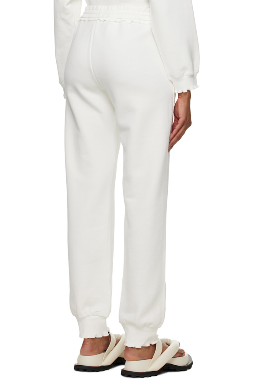 French terry lounge pants. Scalloped edges throughout.

· Drawstring at elasticized waistband
· Two-pocket styling

Supplier color: White chalk