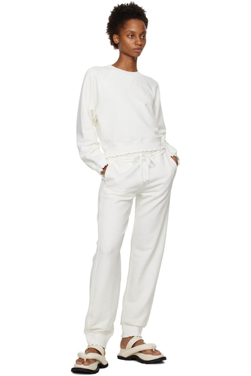 French terry lounge pants. Scalloped edges throughout.

· Drawstring at elasticized waistband
· Two-pocket styling

Supplier color: White chalk
