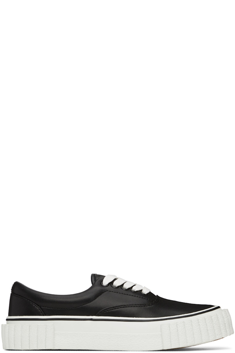 Low-top buffed faux-leather sneakers in black. 

· Lace-up closure
· Padded tongue and collar 
· Canvas lining 
· Textured rubber midsole in white
· Crepe rubber outsole

Supplier color: Black