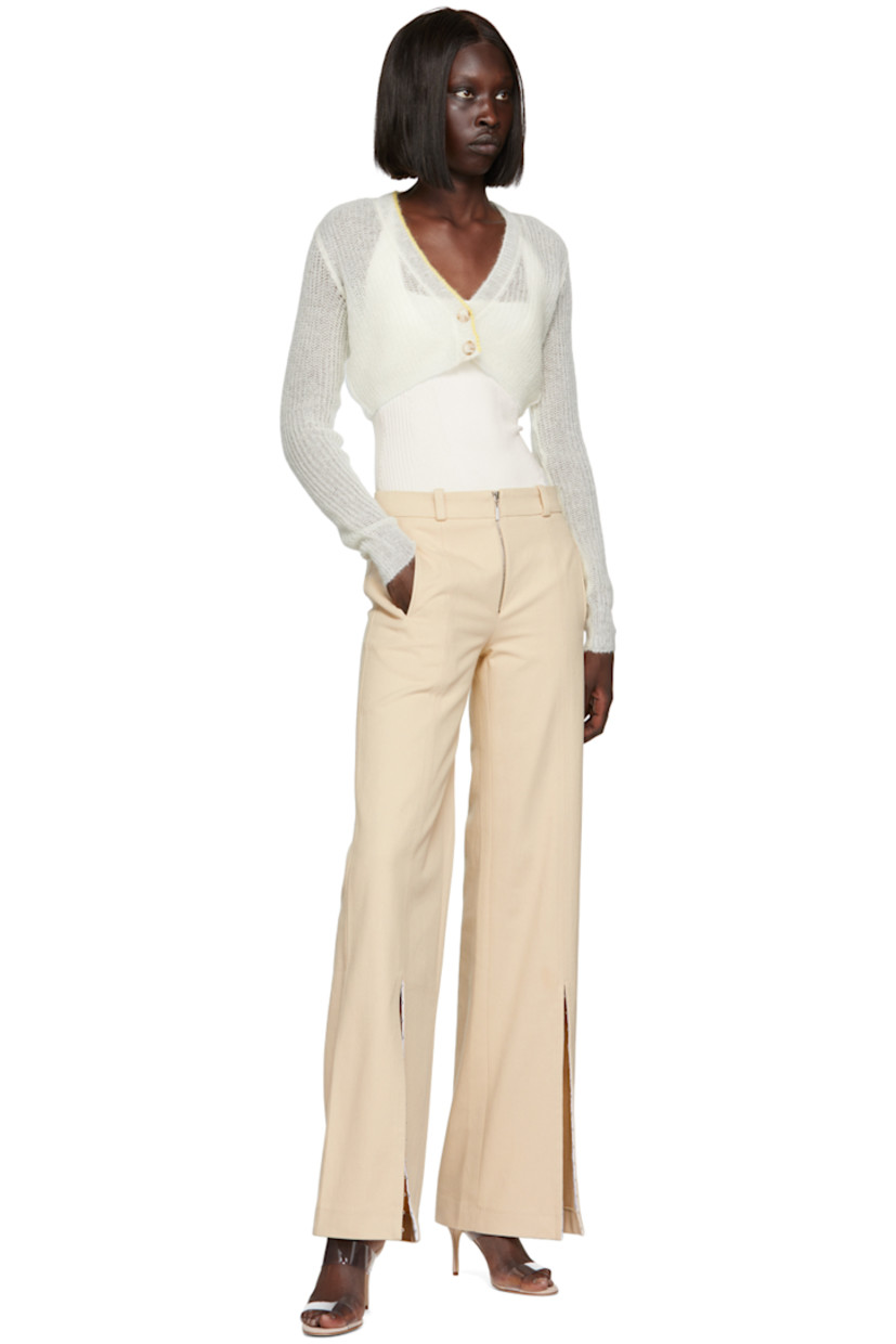 Rib knit stretch viscose bodysuit.

· Layered construction
· V-neck
· Press-stud closure at bottom
· Fixed criss-crossing spaghetti straps
· Self-tie fastening and cutout at back

Supplier color: White