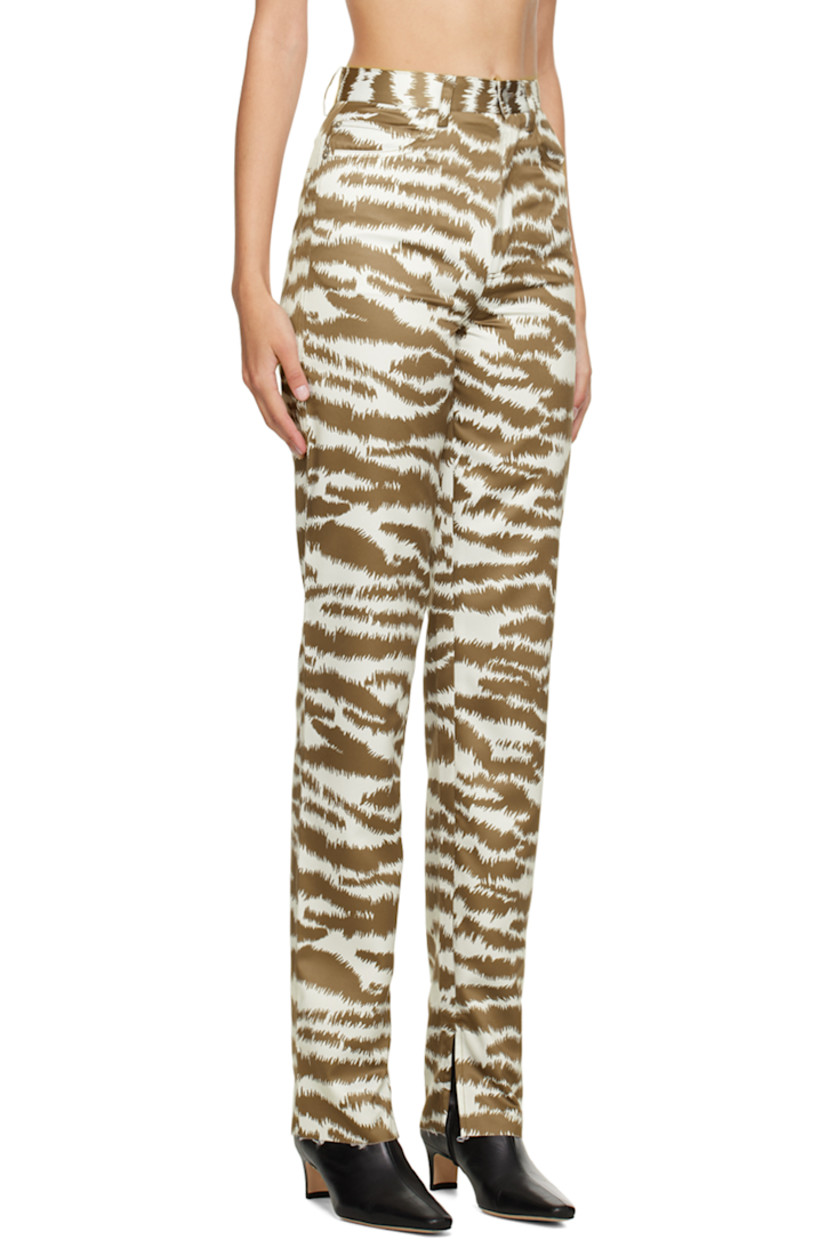 Polyester satin trousers. Graphic pattern throughout. 
 
· Belt loops
· Five-pocket styling
· Zip-fly
· Rubberized logo patch at back waistband
· Vented unfinished cuffs 

Supplier color: Print