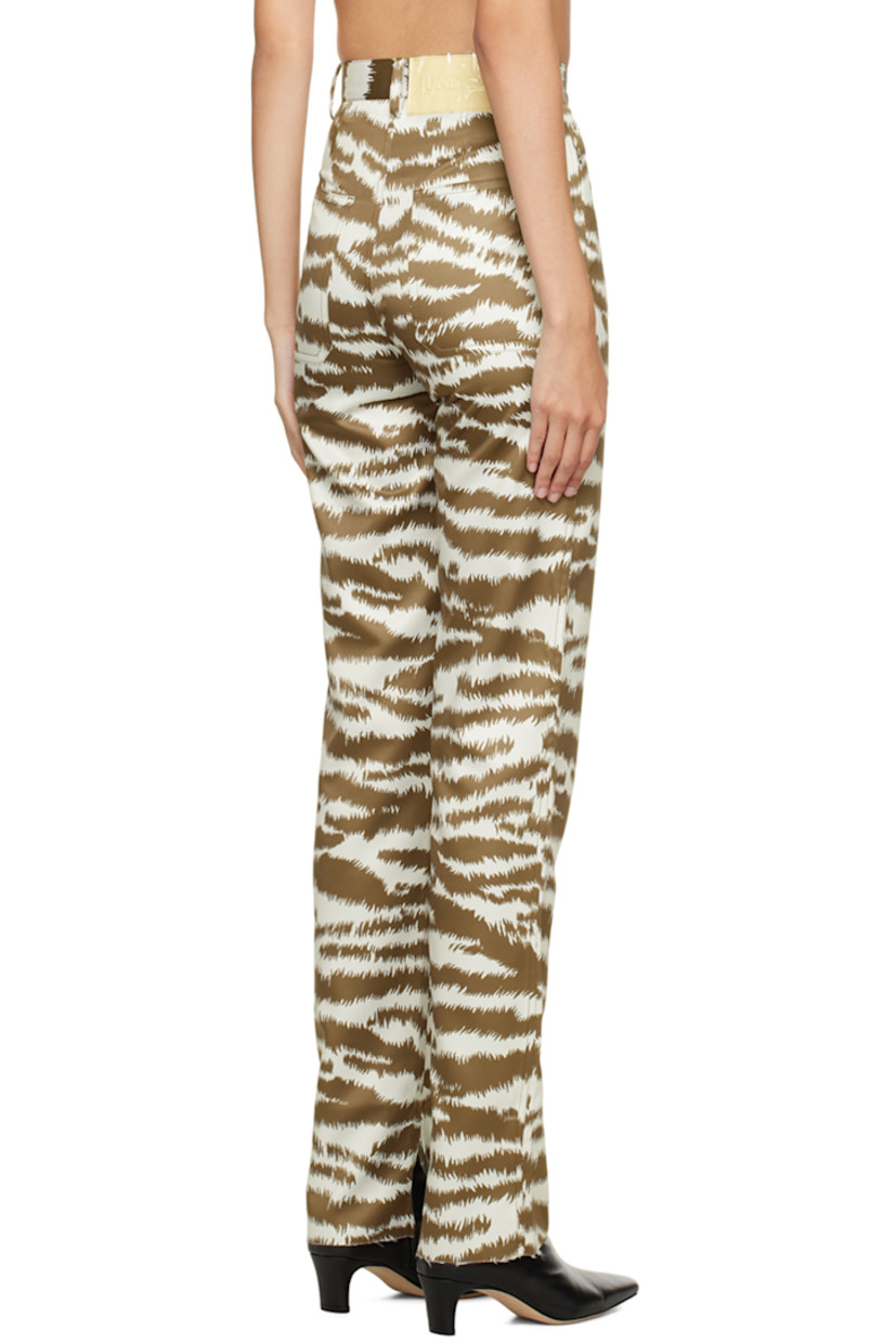 Polyester satin trousers. Graphic pattern throughout. 
 
· Belt loops
· Five-pocket styling
· Zip-fly
· Rubberized logo patch at back waistband
· Vented unfinished cuffs 

Supplier color: Print