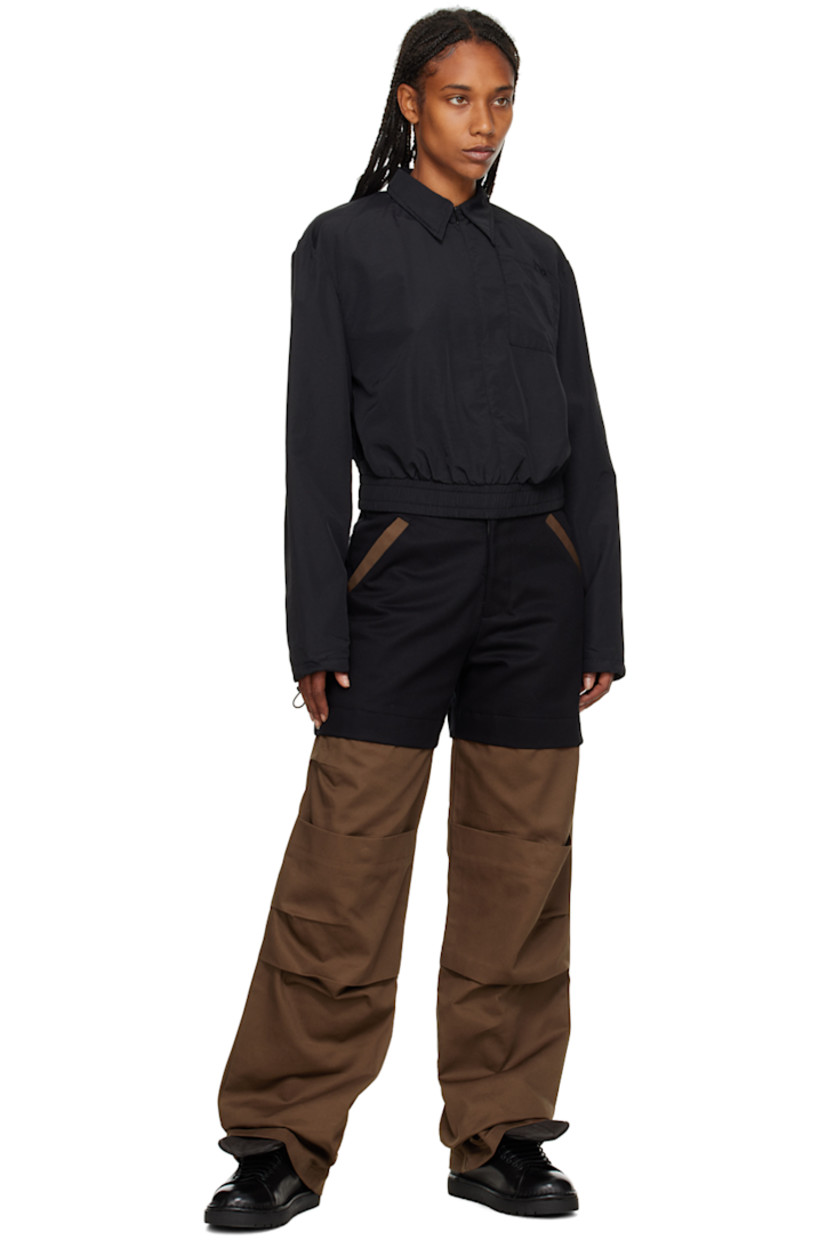 Cotton twill trousers.

· Cutout at waistband
· Five-pocket styling
· Zip-fly
· Storm flaps at front and back

Supplier color: Black/Brown