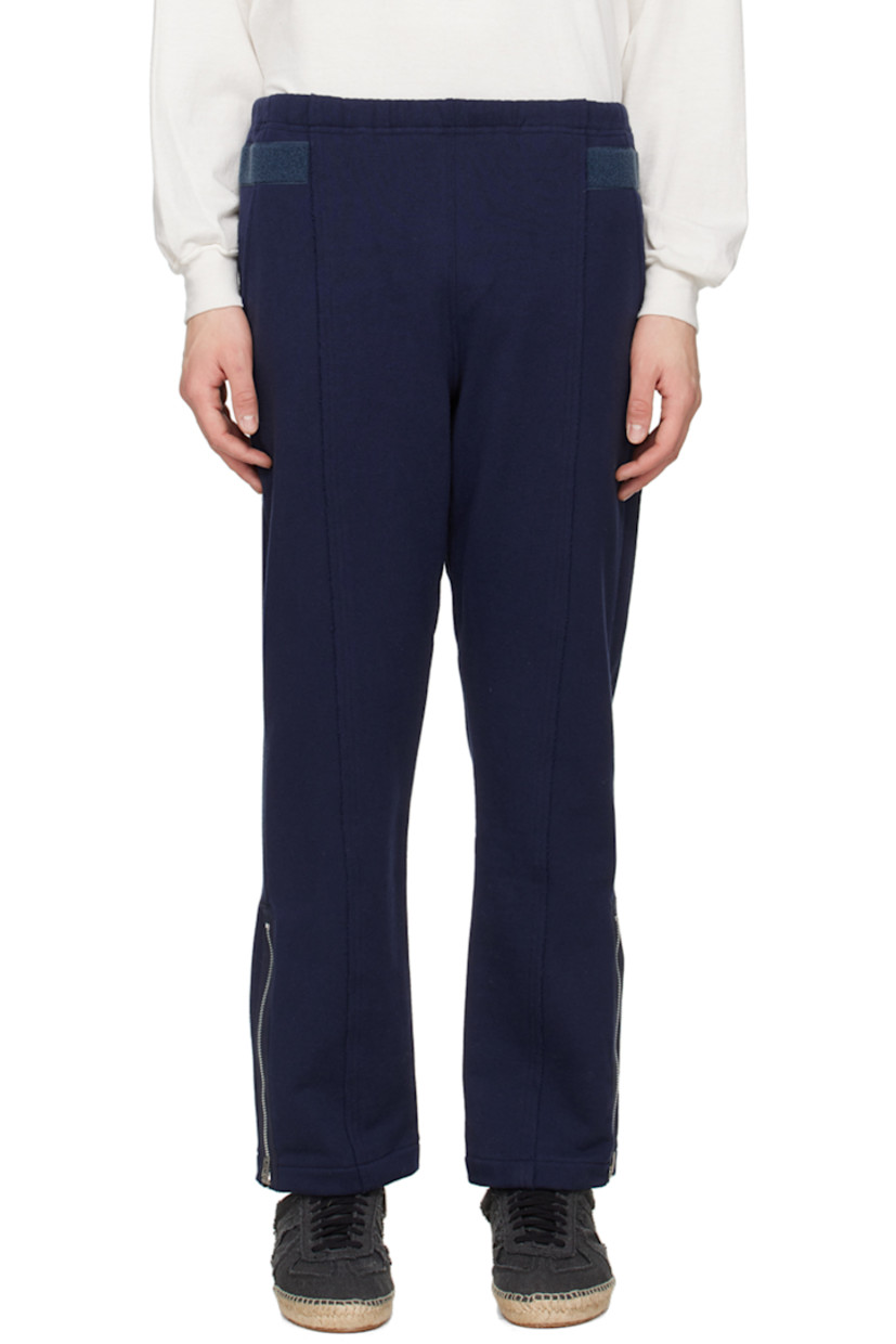 French terry lounge pants. 

· Paneled construction
· Drawstring at elasticized waistband
· Two-pocket styling 
· Zip gusset at cuffs
· Velcro trim at outseams 

Supplier color: Navy