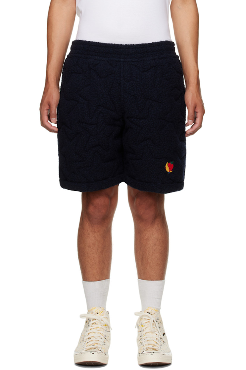 Insulated recycled wool-blend fleece shorts. Quilted graphic pattern throughout. 

· Drawstring at elasticized waistband
· Two-pocket styling
· Rubberized logo patch at front
· Full stretch cotton jersey lining

Supplier color: Navy