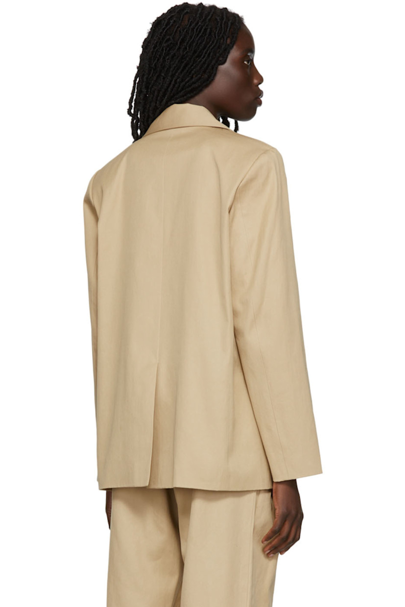 Cotton twill blazer featuring cotton twill vest underlay. 

· Notched lapel 
· Welt pockets 
· Button closure at vest underlay 
· Fully lined

Supplier color: Beige