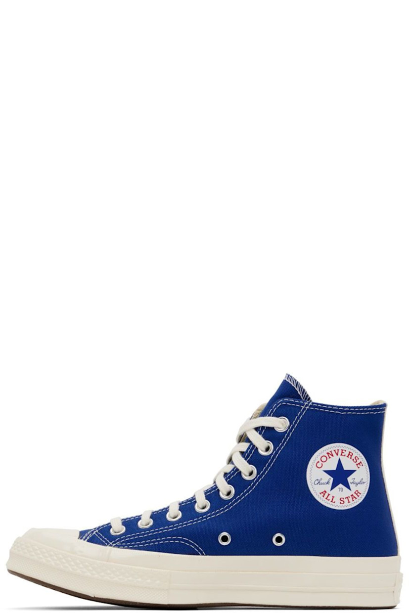 High-top canvas sneakers in blue. Logo graphic printed at outer side. 

· Round rubber cap toe 
· Lace-up closure 
· Logo bonded at inner side
· Webbing trim in off-white at heel
· Ortholite® footbed 
· Rubber midsole in off-white with logo embossed at heel
· Treaded rubber outsole in brown
· Contrast stitching in white 

Part of the Comme des Garçons Play x Converse collaboration.

Supplier color: Blue