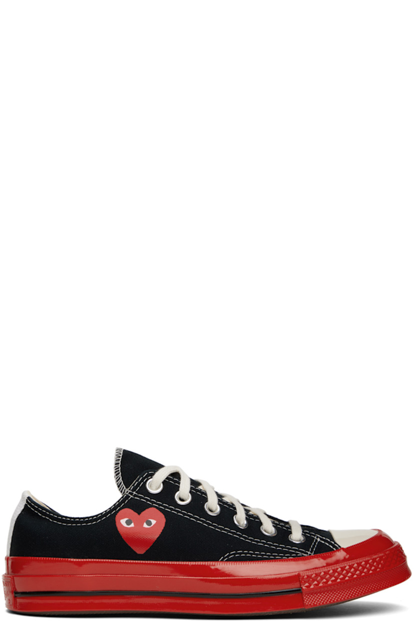 Low-top canvas sneakers in black.

· Round rubber cap toe
· Lace-up closure
· Logo graphic printed at outer side
· Eyelet vents at inner side
· Rubberized logo patch at heel
· Treaded rubber sole

Part of the Comme des Garçons Play x Converse collaboration.

Supplier color: Black