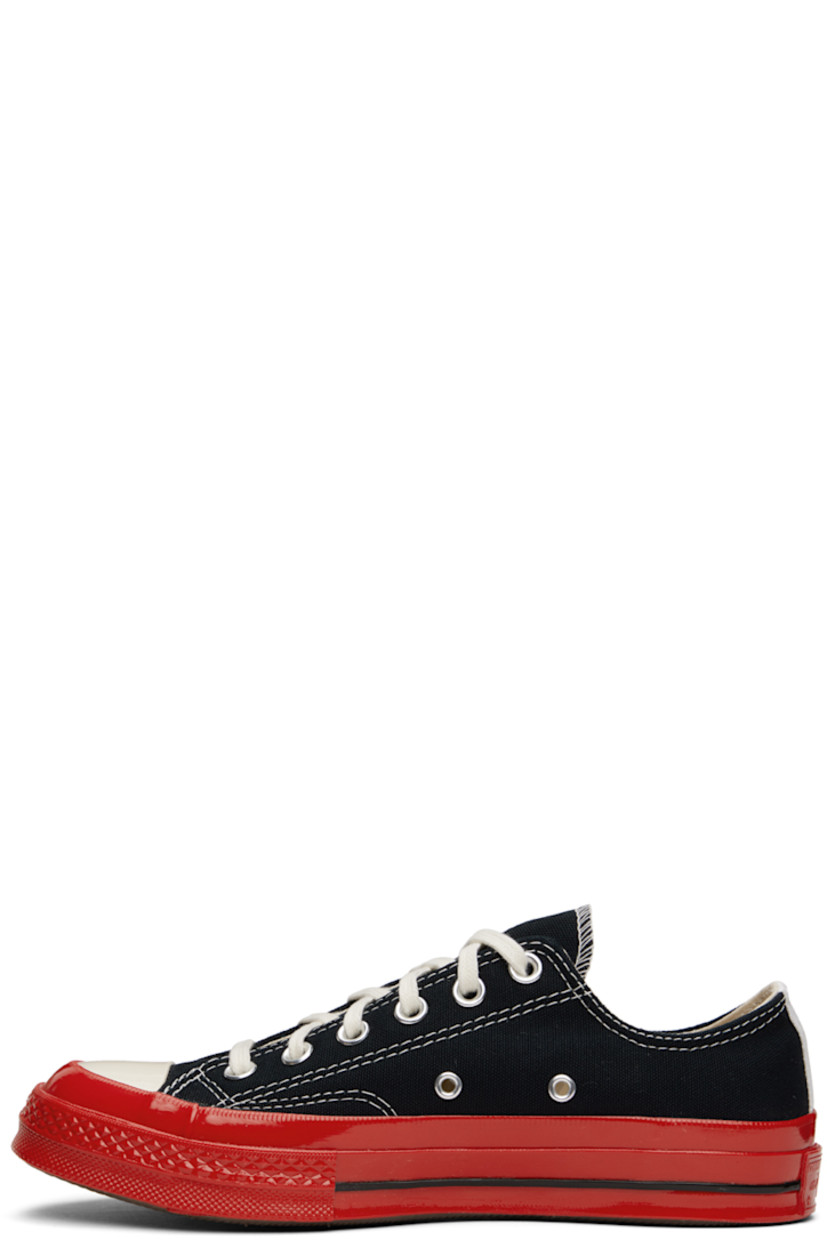 Low-top canvas sneakers in black.

· Round rubber cap toe
· Lace-up closure
· Logo graphic printed at outer side
· Eyelet vents at inner side
· Rubberized logo patch at heel
· Treaded rubber sole

Part of the Comme des Garçons Play x Converse collaboration.

Supplier color: Black