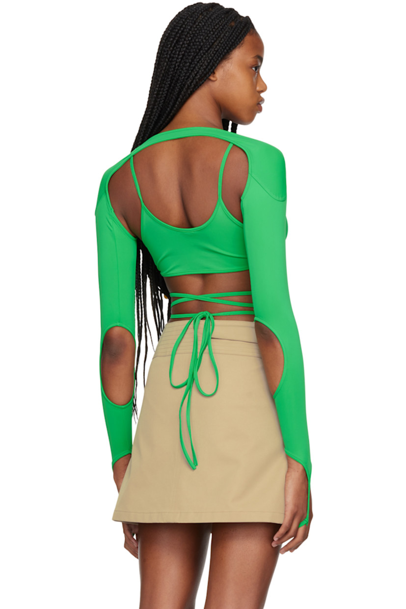 Nylon jersey T-shirt.

· Logo hardware at scoop neck
· Cut-out at front 
· Removable bolero-style sleeves with finger loops
· Wrap-around self-tie strap at back 
· Brass-tone hardware

Supplier: Green