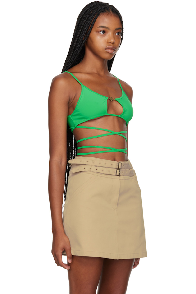 Nylon jersey T-shirt.

· Logo hardware at scoop neck
· Cut-out at front 
· Removable bolero-style sleeves with finger loops
· Wrap-around self-tie strap at back 
· Brass-tone hardware

Supplier: Green