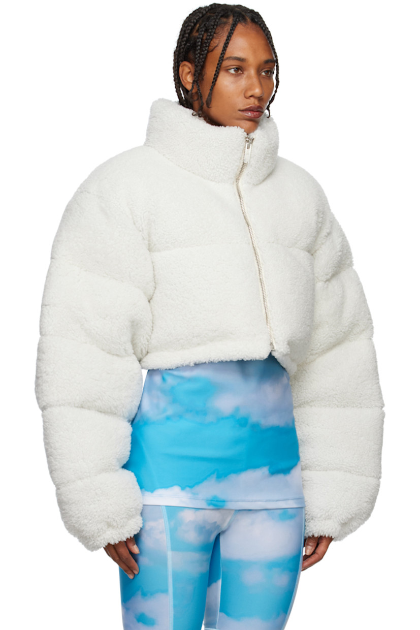 Insulated quilted lamb shearling jacket. 

· Funnel neck 
· Zip closure 
· Concealed bungee-style drawstring at cropped hem 
· Elasticized cuffs 
· Logo-woven satin lining 

Supplier color: Cream