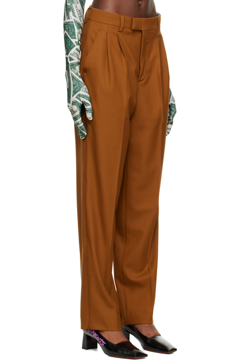 Stretch virgin wool twill trousers. 

· Belt loops
· Hook-eye fastening at waistband 
· Four-pocket styling 
· Zip-fly 
· Pleats at front 
· Zip vent at cuffs 
· Partial viscose sateen lining 

Supplier color: Brown