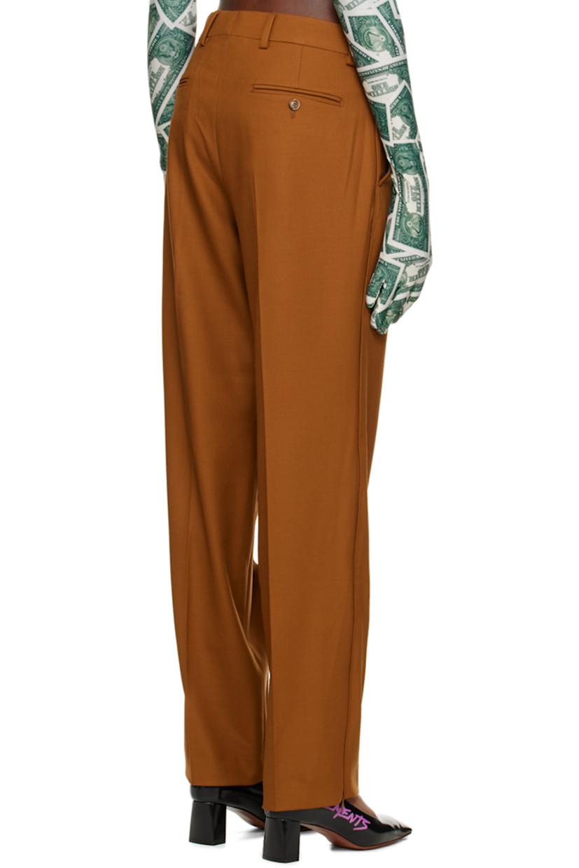 Stretch virgin wool twill trousers. 

· Belt loops
· Hook-eye fastening at waistband 
· Four-pocket styling 
· Zip-fly 
· Pleats at front 
· Zip vent at cuffs 
· Partial viscose sateen lining 

Supplier color: Brown