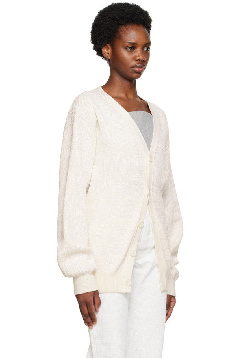 Knit merino wool cardigan. Logo pattern printed throughout. 

· Rib knit Y-neck, hem, and cuffs
· Button closure

Supplier color: White