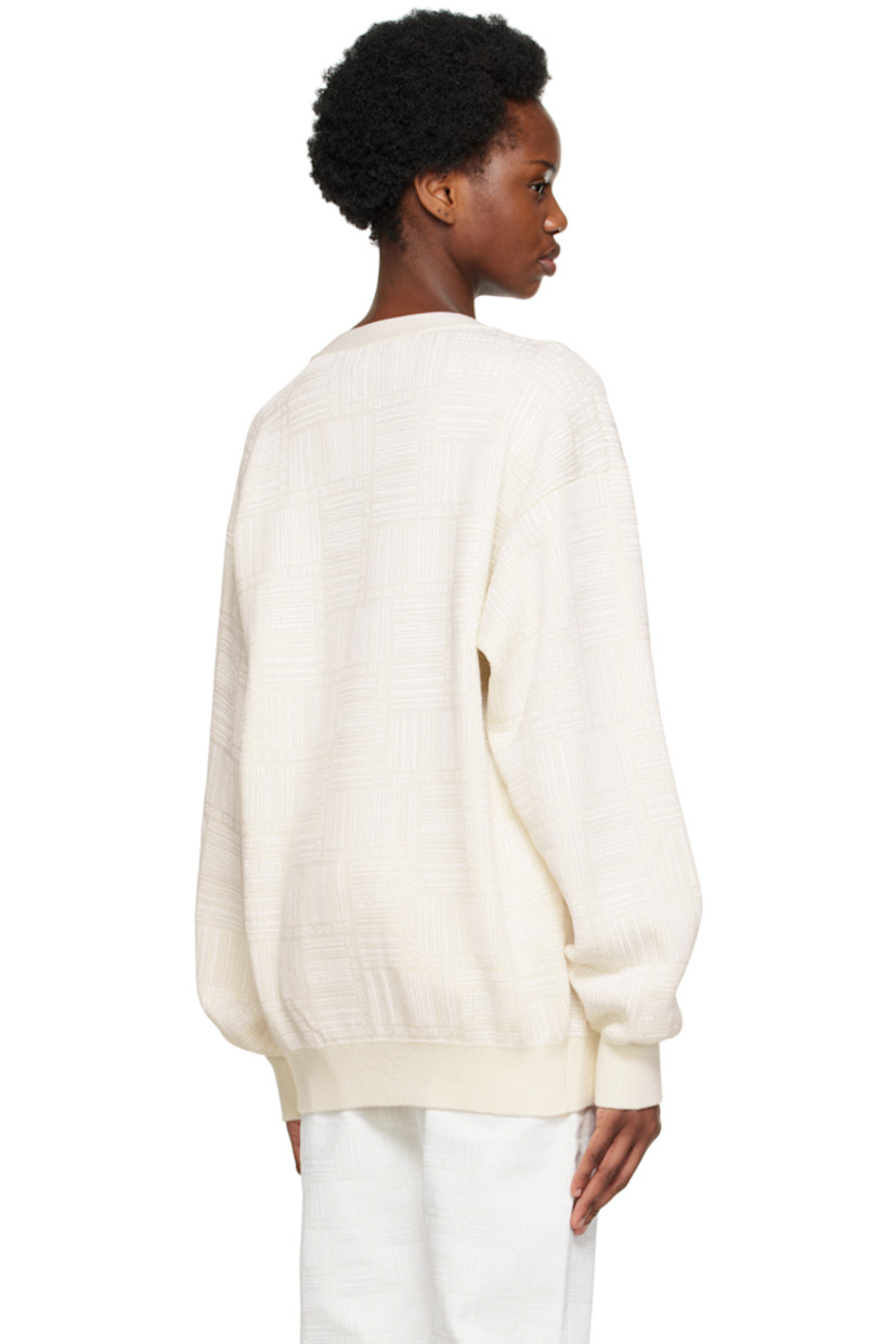 Knit merino wool cardigan. Logo pattern printed throughout. 

· Rib knit Y-neck, hem, and cuffs
· Button closure

Supplier color: White