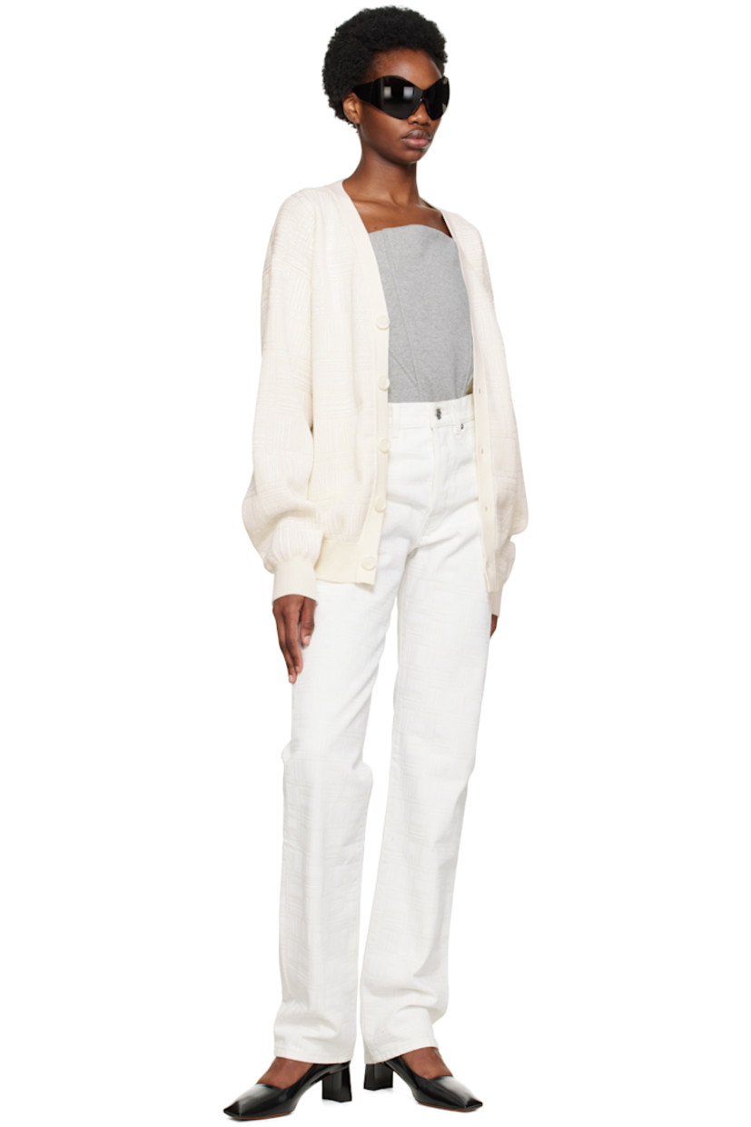 Knit merino wool cardigan. Logo pattern printed throughout. 

· Rib knit Y-neck, hem, and cuffs
· Button closure

Supplier color: White