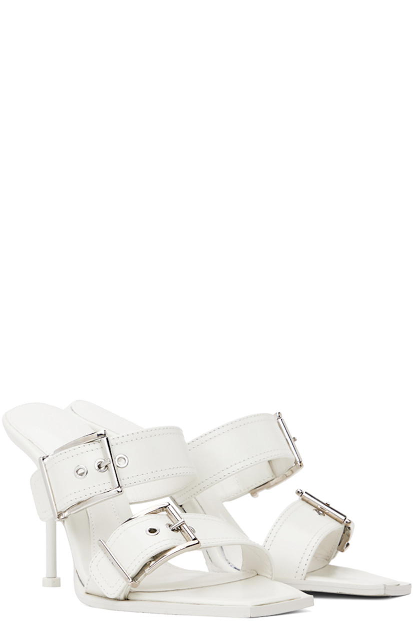 Buffed calfskin slip-on heeled sandals in white.

· Open square toe
· Adjustable pin-buckle straps at vamp
· Logo embossed at padded footbed
· Stiletto heel with rubber injection
· Leather outsole
· Heel: H4.25 in

Supplier color: New ivory/Silver