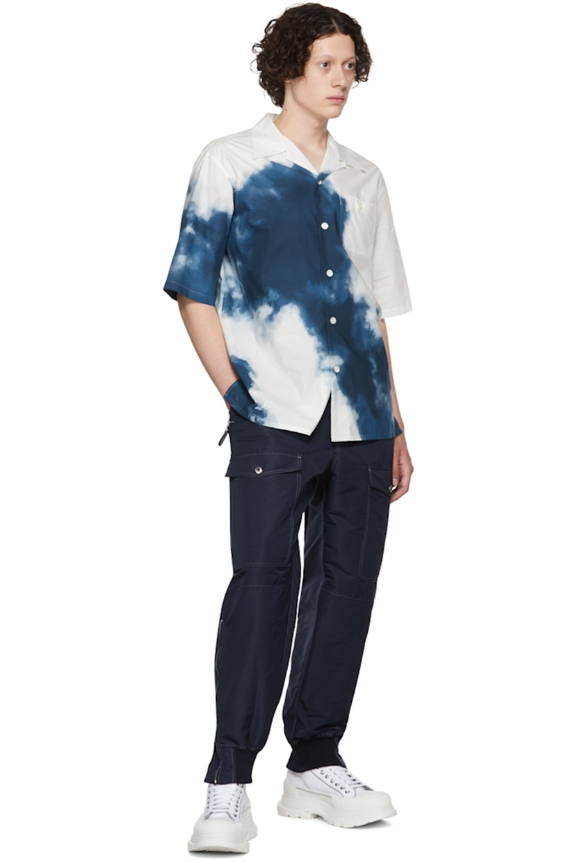 Recycled polyester faille cargo pants. Stretch silk faille trim throughout.

· Belt loops
· Zip-fly
· Adjustable buttoned tab at waistband 
· Flap pockets 
· Cinch strap at back waistband
· Four-pocket styling
· Zip at vented elasticized rib knit cuffs
· Contrast stitching in white

Supplier color: Navy