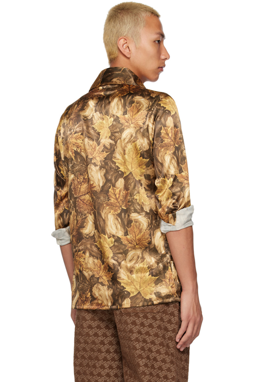 Stretch polyester satin shirt. Graphic pattern and logo printed throughout. 

· Spread collar 
· Button closure 
· Pach pockets
· Single-button barrel cuffs 

Supplier color: Brown