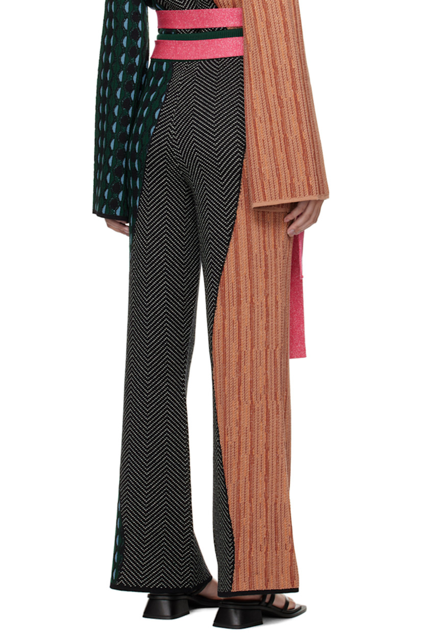 Knit merino wool lounge pants. Graphic jacquard pattern throughout.

· Detachable belt at rib knit waistband
· Belt loops

Part of the Ahluwalia x Woolmark Prize collaboration.

Supplier color: Multico green