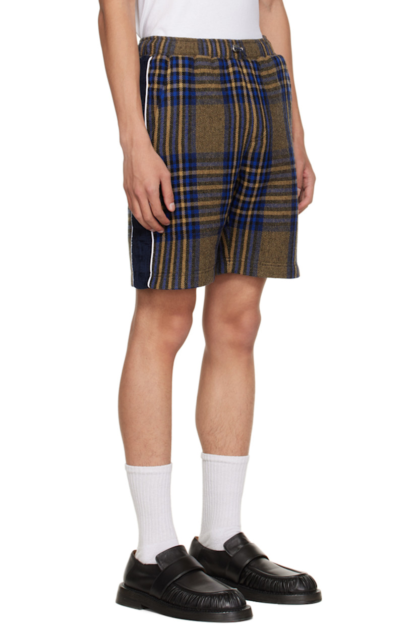 Paneled virgin wool and nylon-blend tweed shorts. Check pattern throughout. 

· Bungee-style drawstring at elasticized waistband 
· Two-pocket styling 
· Corduroy panels at outseams 
· Full cupro satin lining 

Supplier color: Blue