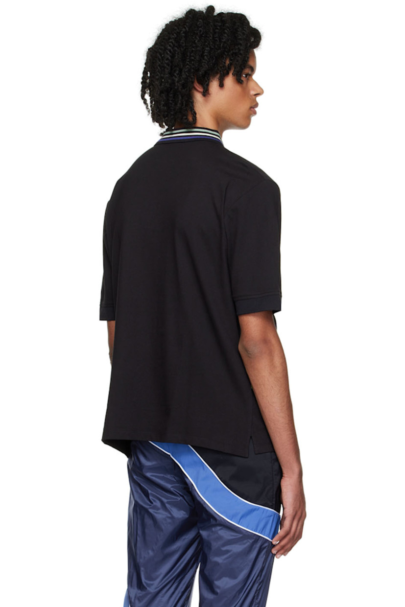 Organic cotton piqué polo. 

· Spread collar
· Half-zip closure
· Beaded detailing and satin trim at front
· Vented side seams

Supplier color: Black
