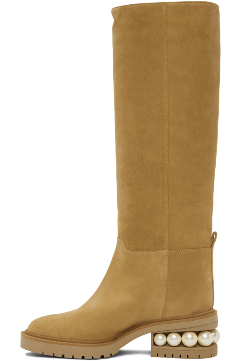 Calf-high paneled suede boots in tan. Signature faux-pearls at block heel.

· Pull-loop at heel counter
· Treaded rubber sole
· Heel: H2 in

Supplier color: Hazel
