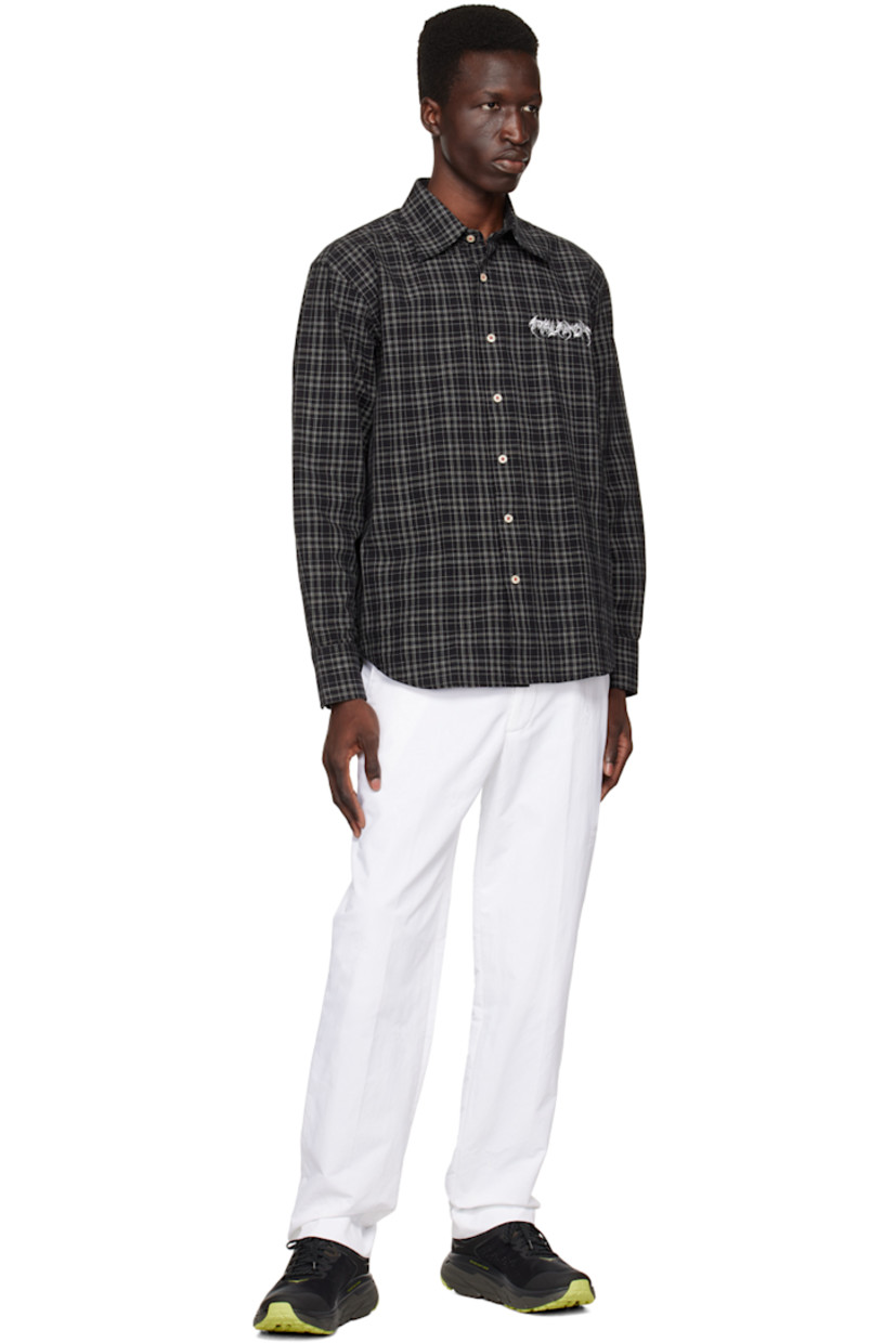 Nylon twill trousers. Logo pattern embroidered throughout.

· Belt loops
· Three-pocket styling
· Zip-fly
· Creased legs
· Darts at back waistband
· Rubberized logo patch at back

Supplier color: White