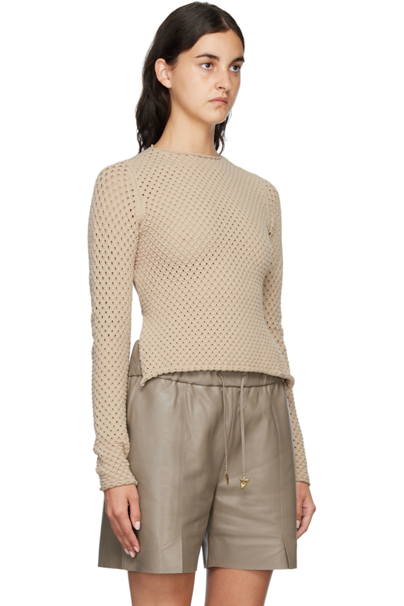 Knit stretch Ecovero™ viscose and polyester-blend sweater. 

· Rolled edge at crewneck, cuffs, and hem
· Cutout at back
· Hand-crocheted strap at back 
· Logo plaque at back 

Supplier color: Sand