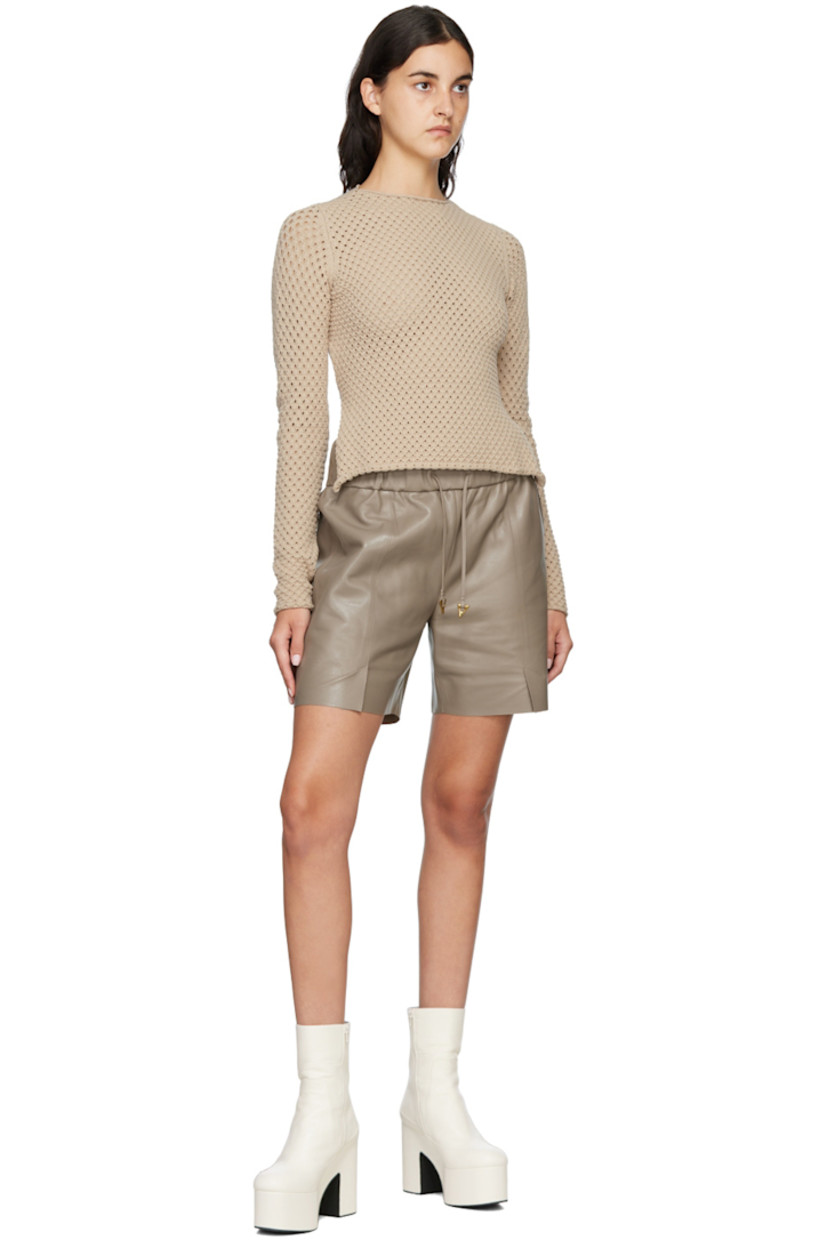 Knit stretch Ecovero™ viscose and polyester-blend sweater. 

· Rolled edge at crewneck, cuffs, and hem
· Cutout at back
· Hand-crocheted strap at back 
· Logo plaque at back 

Supplier color: Sand