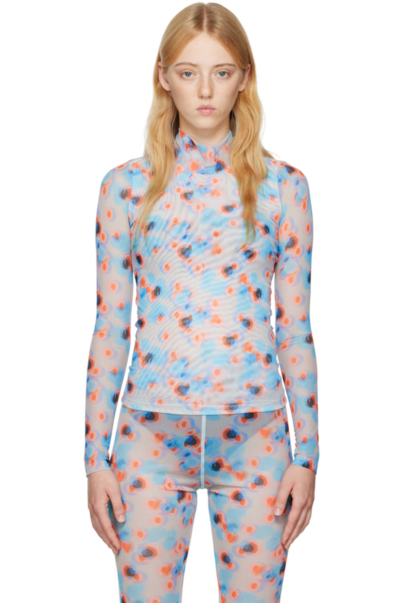 Semi-sheer stretch recycled polyester mesh turtleneck. 

· Partial mesh lining
· Polka dot pattern printed throughout

Supplier color: Dots orange/Lavender