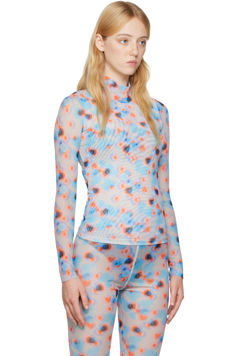 Semi-sheer stretch recycled polyester mesh turtleneck. 

· Partial mesh lining
· Polka dot pattern printed throughout

Supplier color: Dots orange/Lavender