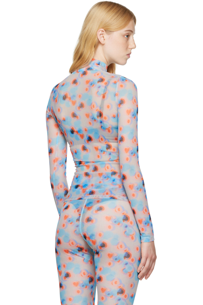 Semi-sheer stretch recycled polyester mesh turtleneck. 

· Partial mesh lining
· Polka dot pattern printed throughout

Supplier color: Dots orange/Lavender