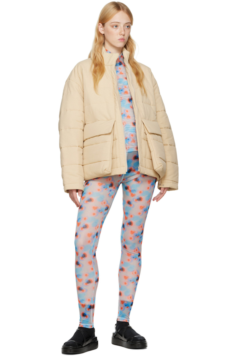Semi-sheer stretch recycled polyester mesh turtleneck. 

· Partial mesh lining
· Polka dot pattern printed throughout

Supplier color: Dots orange/Lavender