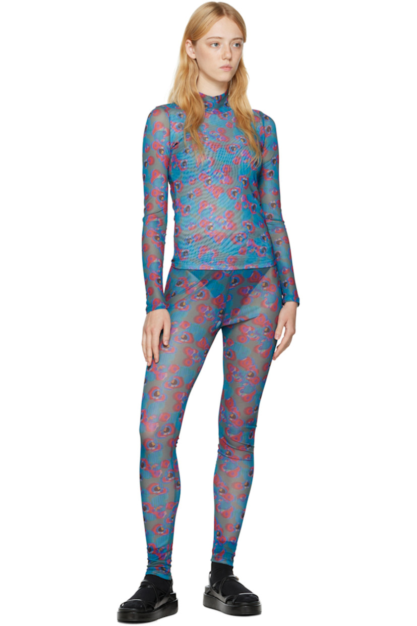 Semi-sheer stretch recycled polyester mesh turtleneck. 

· Partial mesh lining
· Polka dot pattern printed throughout

Supplier color: Dots petrol/Bordeaux