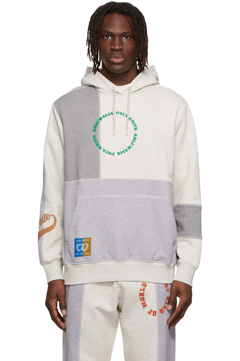 Paneled French terry hoodie. 

· Drawstring at hood
· Logo flocked at front
· Kangaroo pocket 
· Logo embroidered at sleeve
· Graphic logo printed at back 

Wholesale exclusivity at SSENSE.

Supplier color: Grey